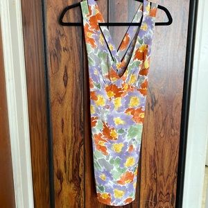 Very cute mini dress multi colored with adorable back details